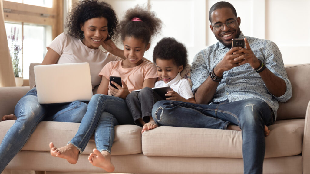 Family spending time together using devices.